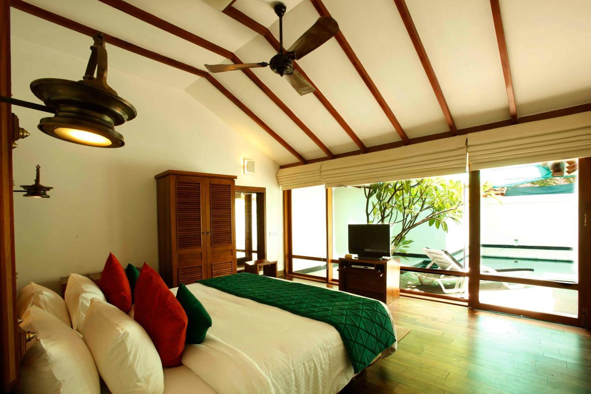 马杜赖遗产酒店 客房 照片 A bedroom at the resort