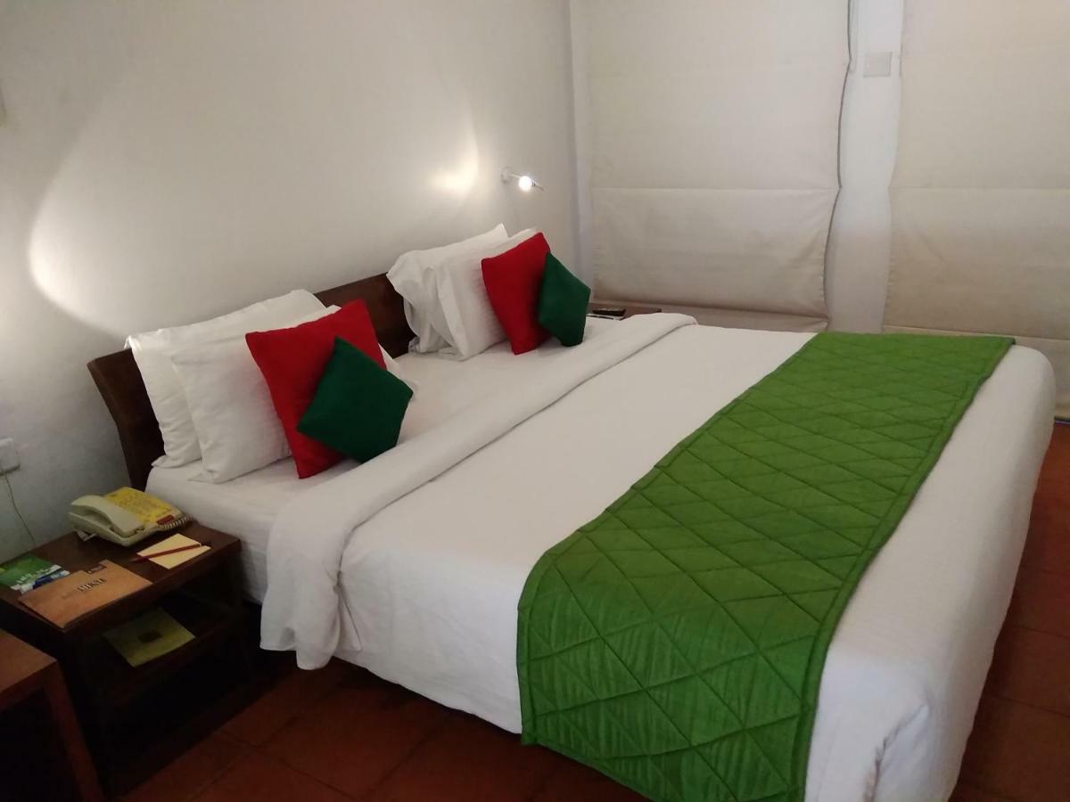 马杜赖遗产酒店 外观 照片 A bed